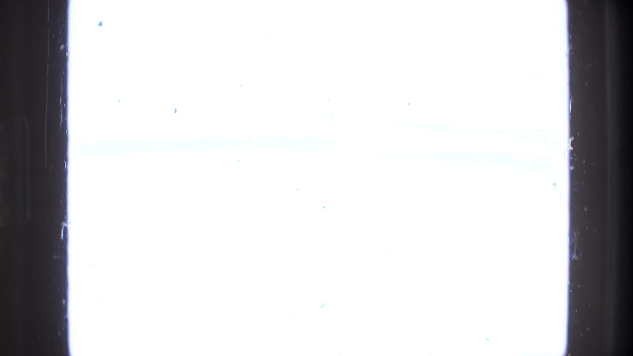 Overexposed white film frame with dark vertical frame edges and little visible scene detail.