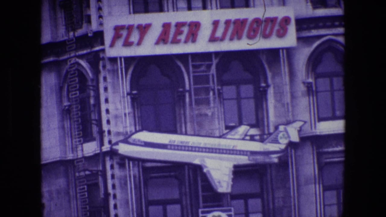 Closer view of a FLY AER LINGUS sign with an airplane model below it.