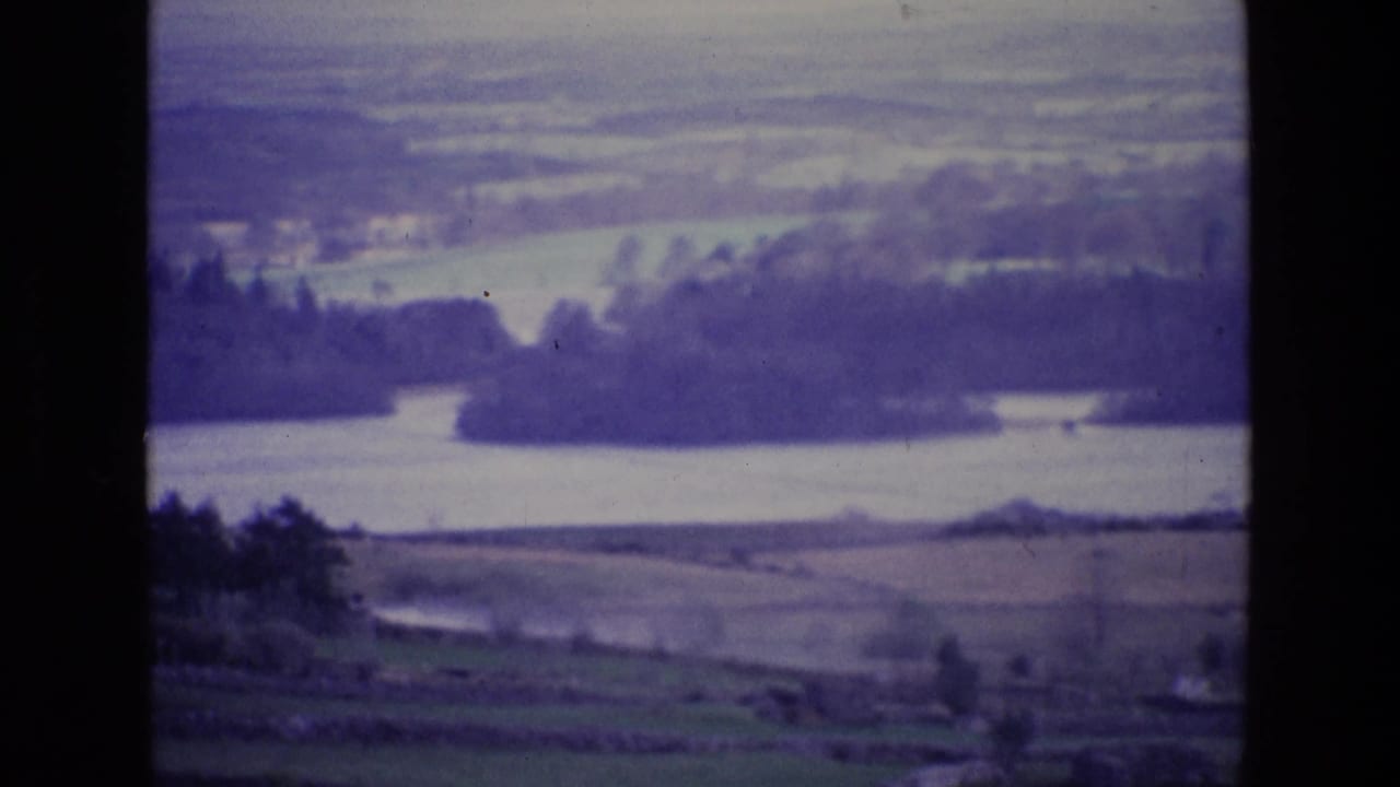 River and tree-lined fields seen from a distant elevated viewpoint.