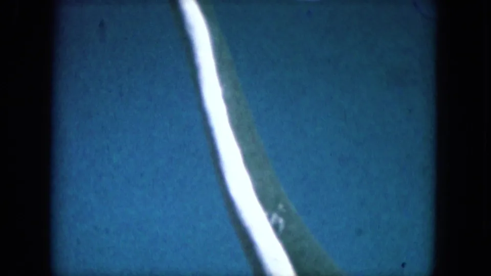 1969 Lake Canyon 8mm frame with a closer view of the green curved subject and white stripe over blue.