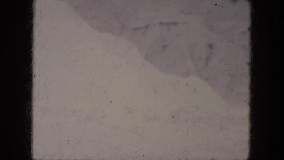 1969 Lake Canyon, Arizona frame showing a muted snow field with soft mounds and pronounced 8mm gate borders.