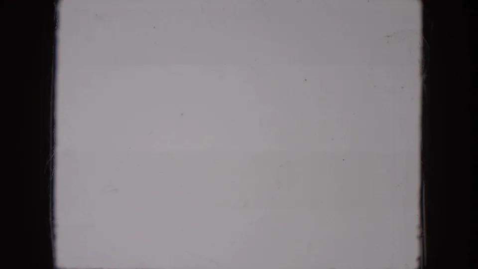 The sequence ends on a mostly blank 8mm frame with pale exposure, dust marks, and dark film edges.