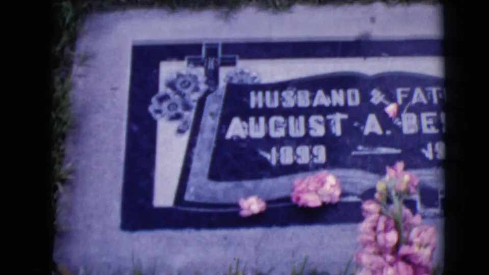 A second close view shows the August A. Berndt grave marker at an angle, with flowers resting near the inscription.