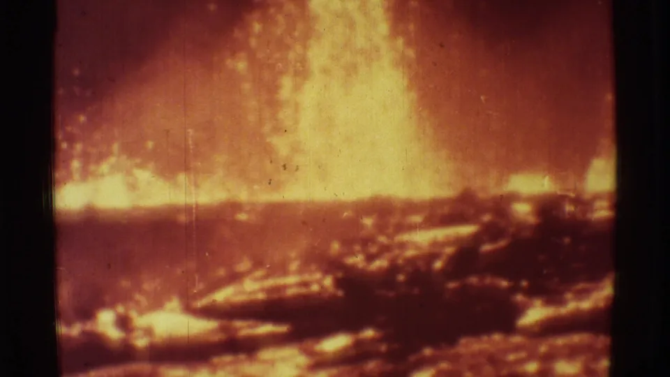 1971 Mauna Ulu frame with a large lava fountain, glowing eruption line, dark foreground, and visible 8mm wear.