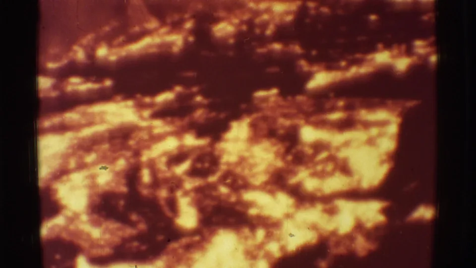 The final 1971 Mauna Ulu frame shows a glowing lava surface with bright highlights, dark crust, and visible 8mm film wear.