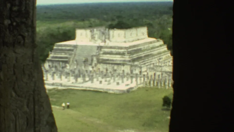 A zoomed 8mm view shows the stepped temple and carved upper structure framed by dark foreground edges.