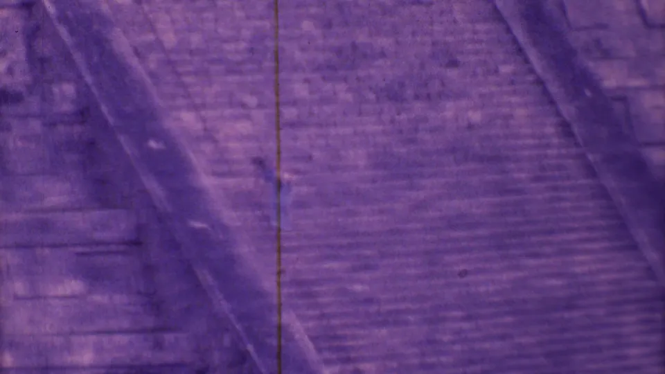 The camera holds on steep masonry steps and a diagonal pyramid edge, with no close facial detail visible.