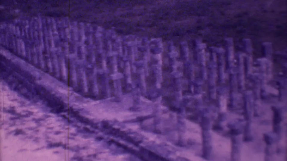 1973 Mexico City 8mm view of a low stone border and many short pillars, with blur and purple color shift.