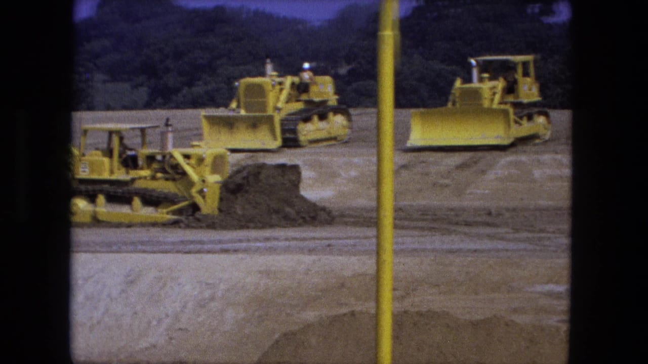 1974 Fort Wayne excavation view with yellow tracked bulldozers spread across an open dirt work area.
