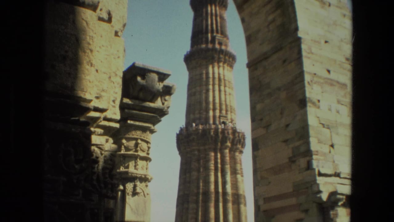 Tower and stone archways with carved architectural details.