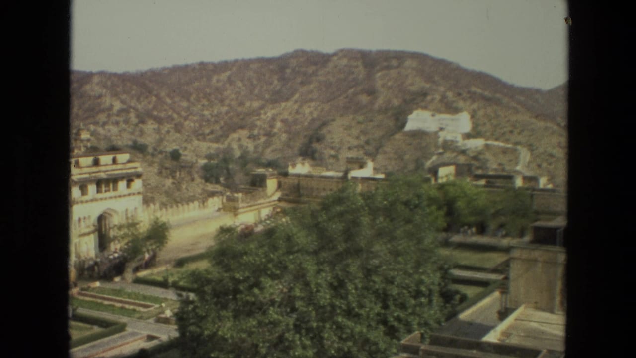 Palace complex and arid hills seen from an elevated vantage point.
