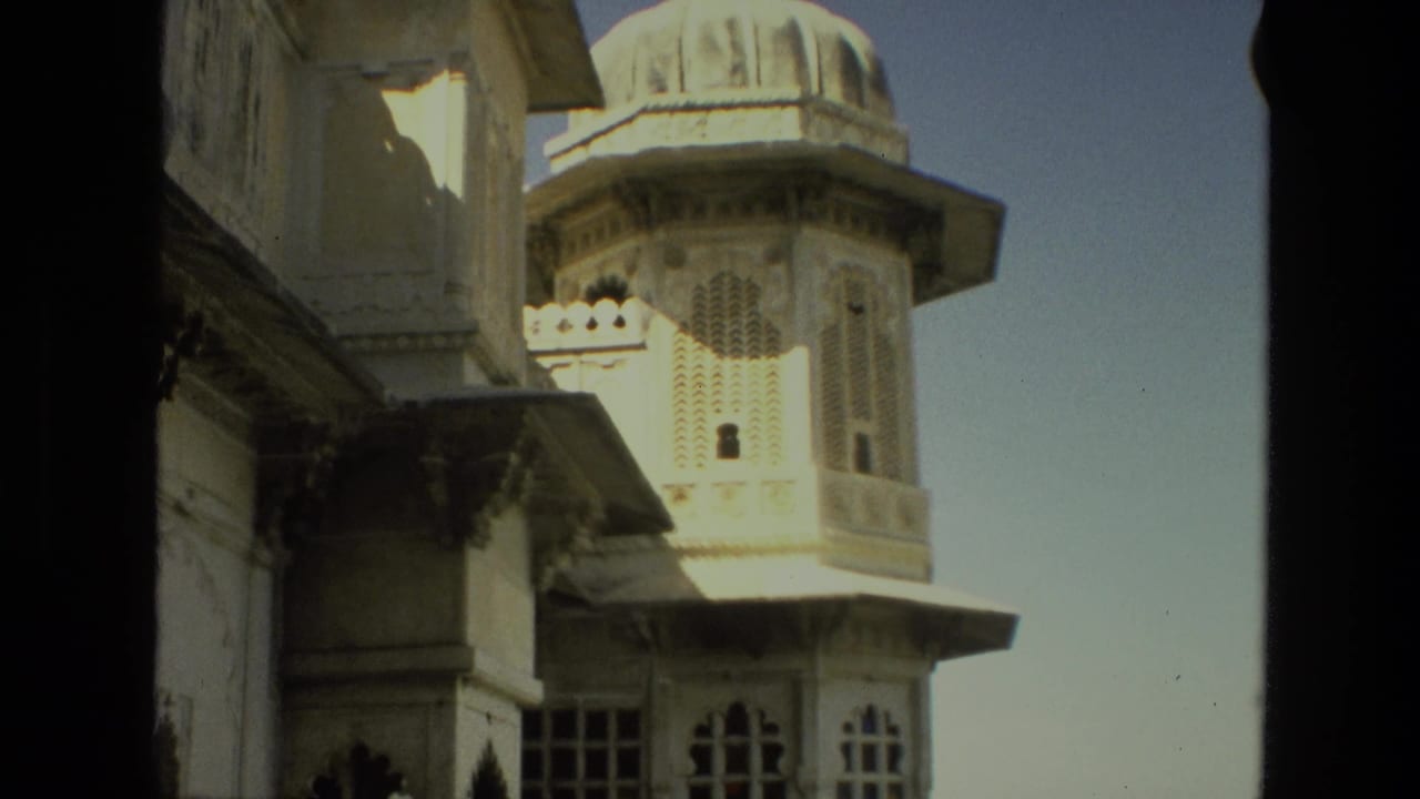Ornate palace tower and windows framed by a dark vertical divider.