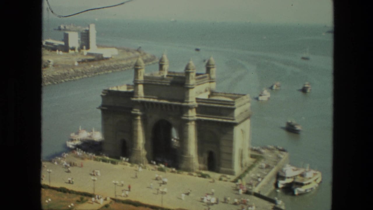 Gateway of India and harbor boats seen from an elevated angle.
