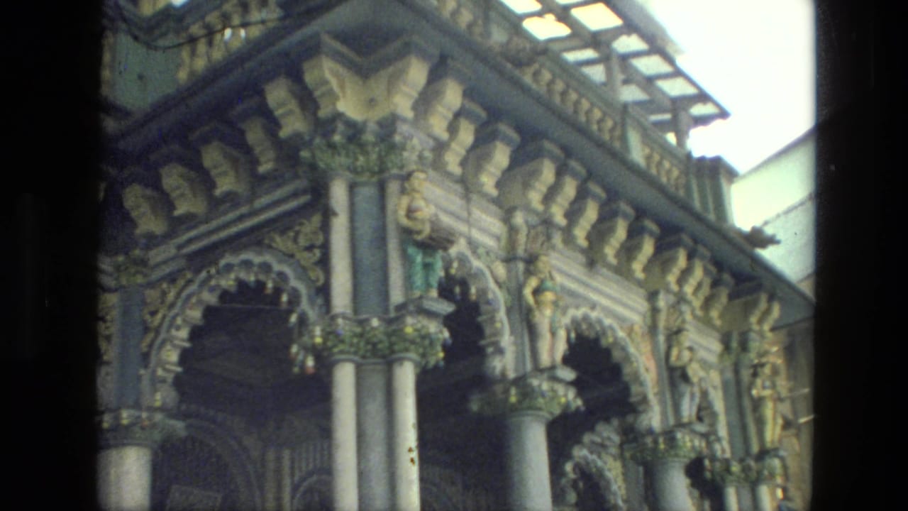 Similar ornate facade detail with arches, columns, roofline, and sculptural decoration.