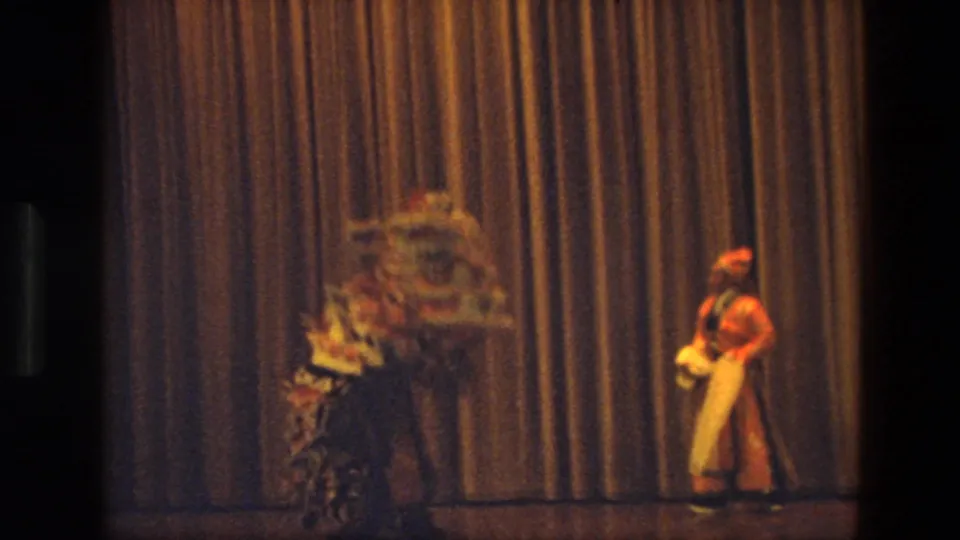 The final frame shows the costumed dancers separated, one partly blurred in motion near the curtain and one at stage right.