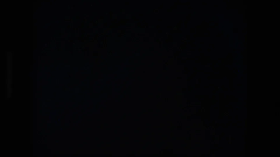 End frame from the 8mm clip is largely dark, with minimal visible roadway or vehicle detail remaining.