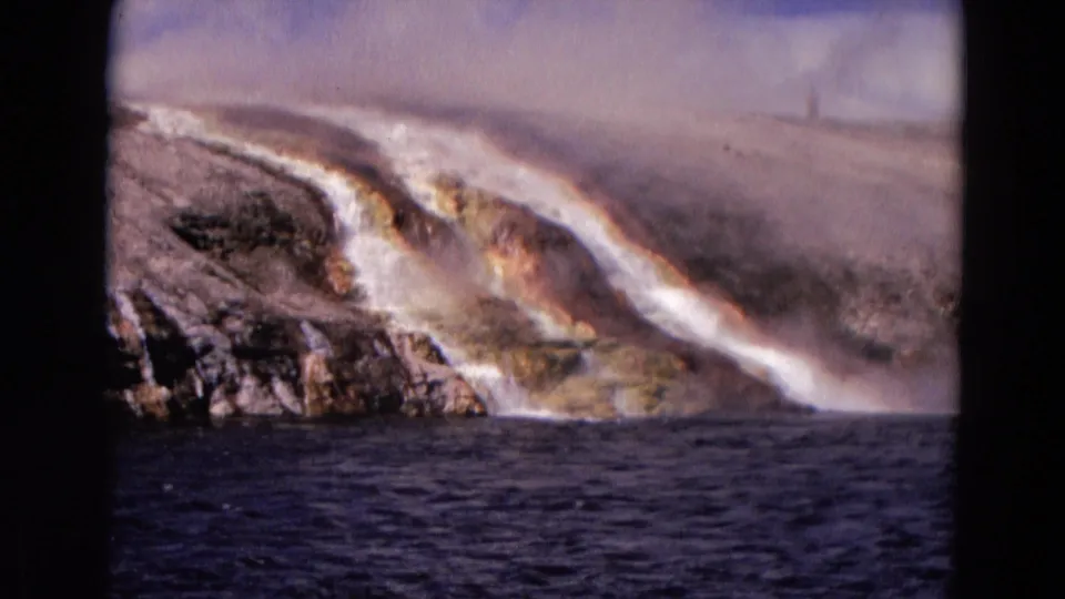 The final frame shows the Yellowstone geothermal slope from a visitor angle, with steam, mineral-stained rock, and dark water below.