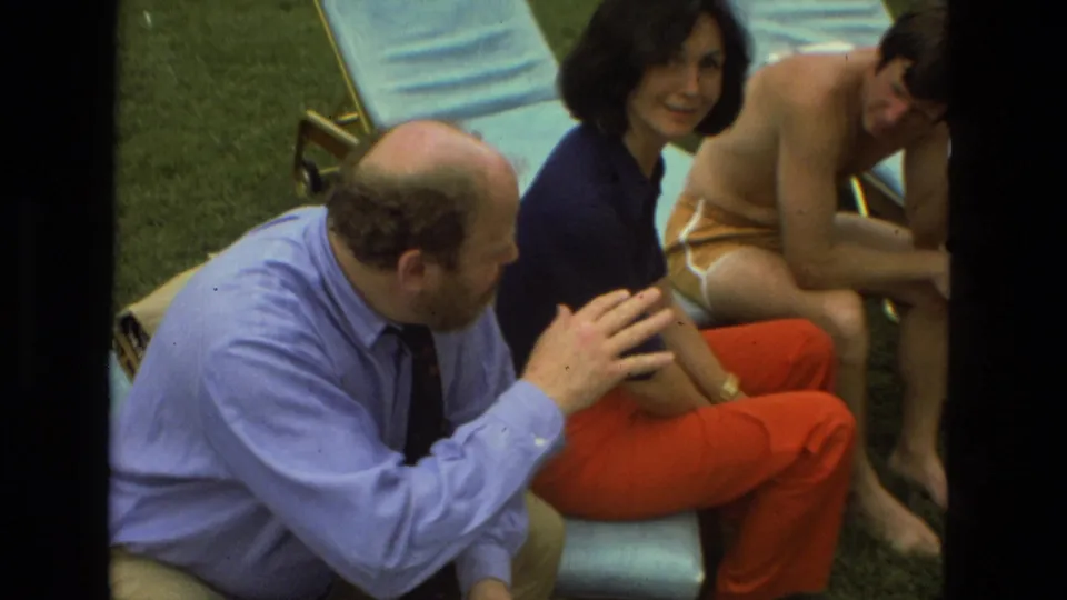 1978 Las Vegas outdoor social scene with adults on lounge chairs, a man gesturing, and casual swimwear visible.