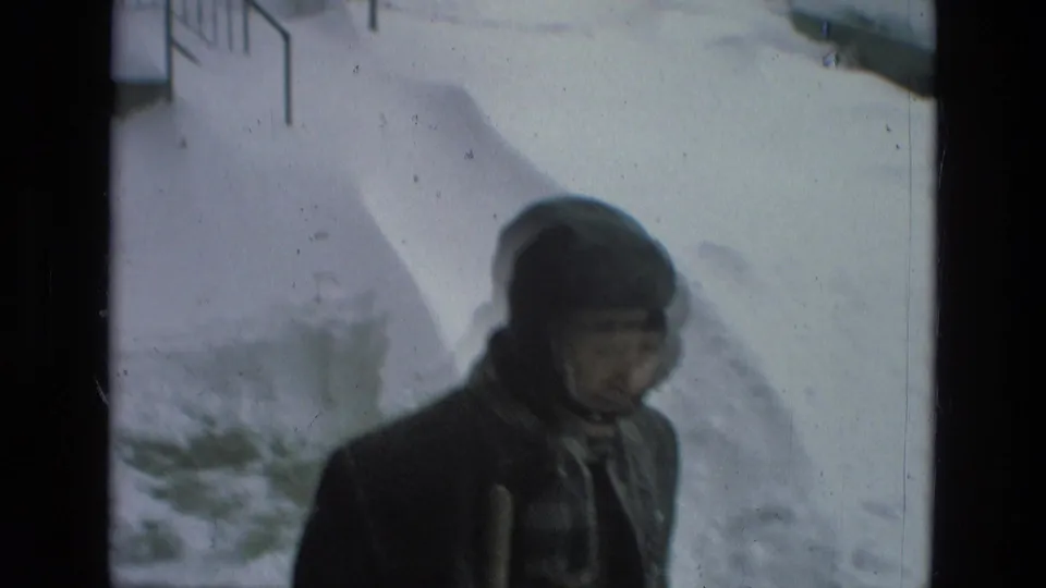 Brief contrasting frame shows a bundled person outdoors in snow, separate from the Las Vegas poolside scene.