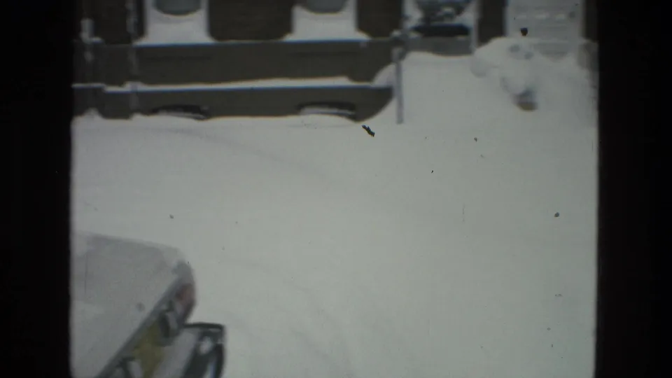 1978 residential winter view in Drexel Hill, showing snow across the street and sidewalks with brick house fronts beyond.