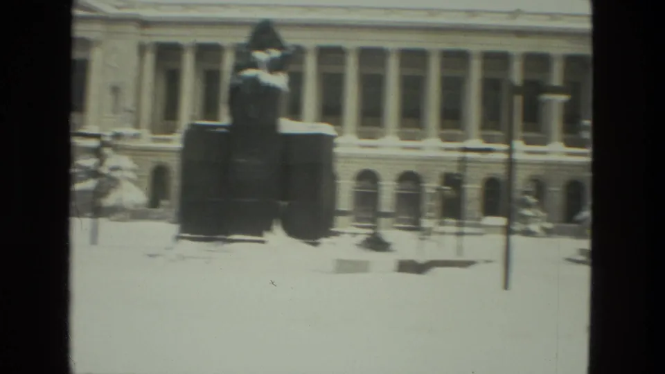 Drexel Hill, Pennsylvania 1978 home-movie frame showing a snowy columned building and dark statue-like foreground form.