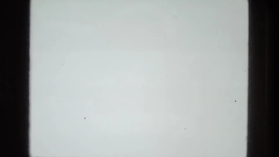 End frame from the 1978 8mm clip showing a mostly pale exposed area with a dark film edge and minimal visible detail.