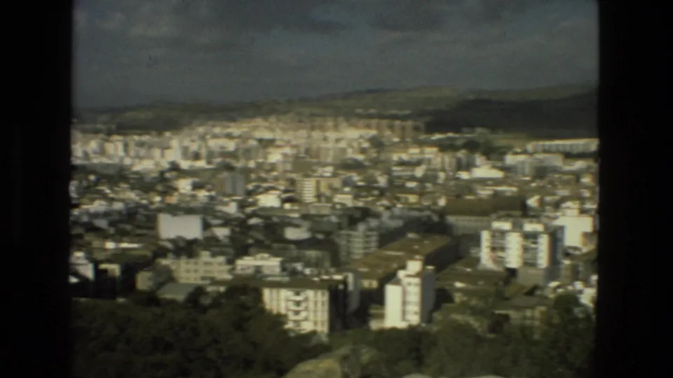 Granada, Spain, 1978 Super 8 frame of the city spread below a hillside viewpoint and distant mountains.