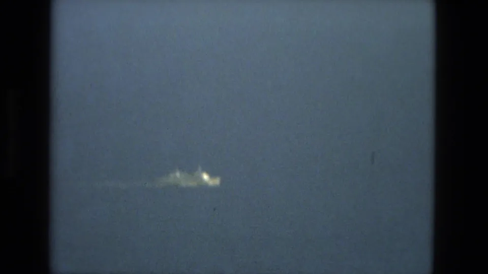 The bright object appears larger and blurred in the upper blue-gray sky, framed by dark 8mm borders and contact-sheet separation.