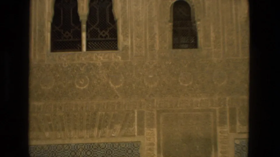 1978 8mm travel frame showing Moorish-style architectural detail with arched windows and patterned stonework in Spain.