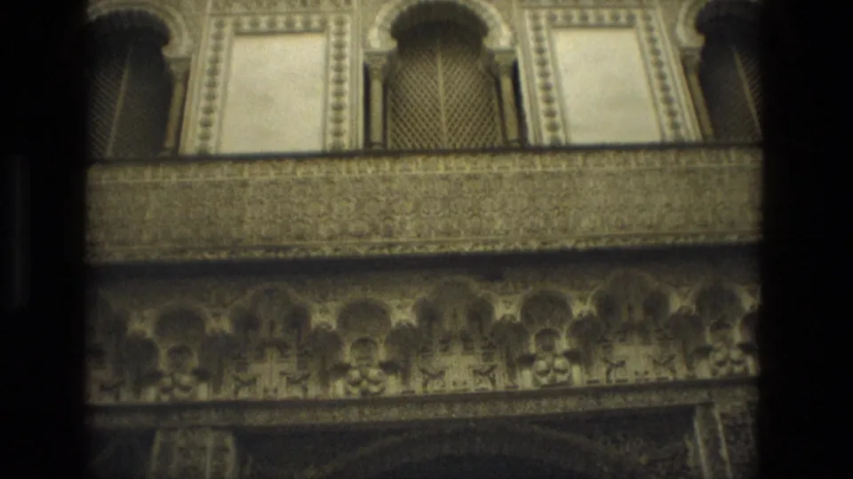 Seville 1978 8mm close view of carved upper gallery decoration, latticed openings, and dense ornamental trim.