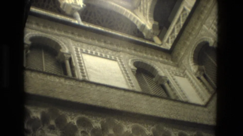 Ornate Seville architectural detail from 1978 footage, showing repeated arches, closed shutters, and decorative wall panels.