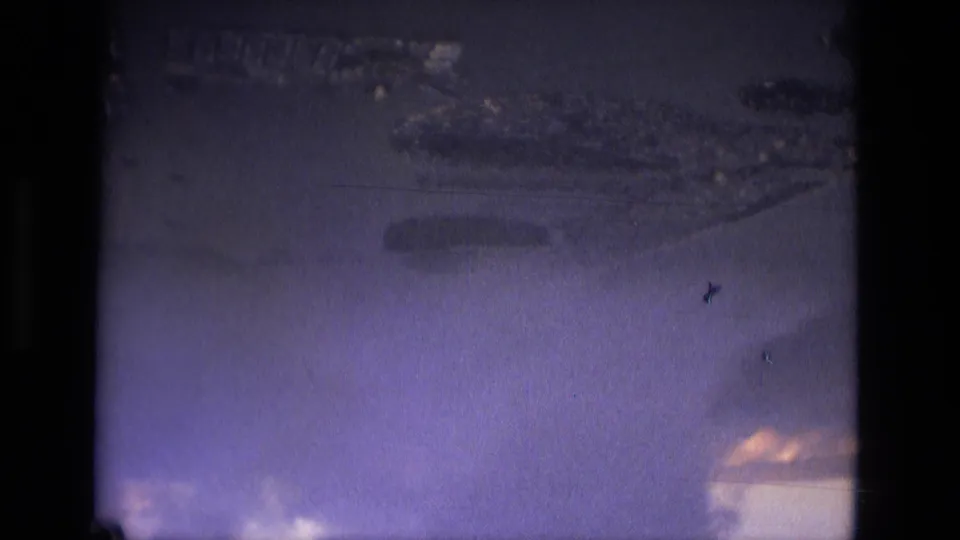 1979 8mm aerial footage near Manaus showing clouded sky, indistinct ground below, and visible home-movie film wear.