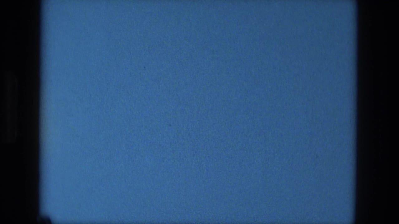 Blue 8mm frame with black film edges and visible grain.