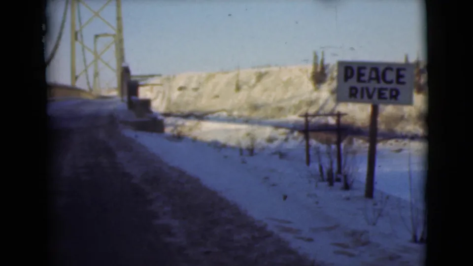 The final frame shows a bridge structure at left, the snowy road ahead, and the Peace River sign beside the winter river landscape.