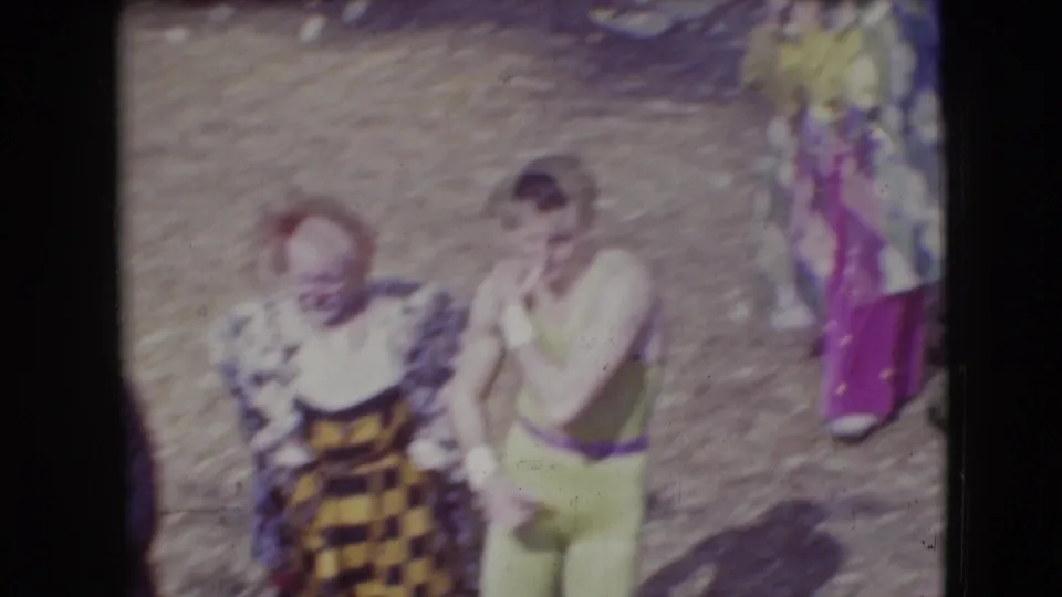 1948 Sarasota circus footage showing costumed performers standing on dusty grounds near the animal encampment.