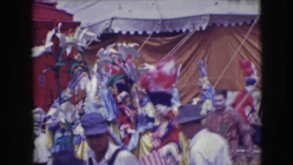 1948 Ringling Brothers Sarasota scene with feathered performers, tent canvas, and audience members crossing the foreground.