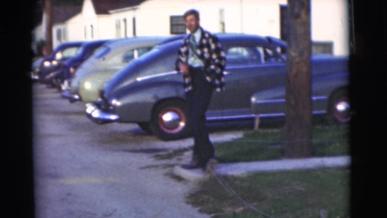 The final frame shows the young man by a driveway in Chatham, New Jersey, with a row of rounded parked cars and residential buildings behind him.