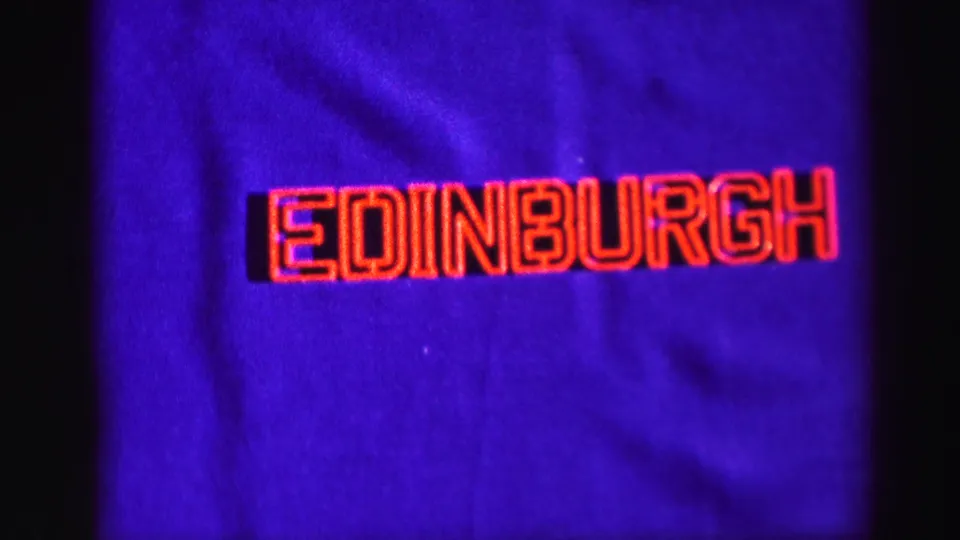 1952 8mm title card for Edinburgh, shown as red lettering on a deep blue background.