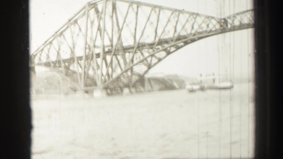 A boat-level 1952 view shows the Forth Bridge's lower arching support and lattice trusses above the Firth of Forth.