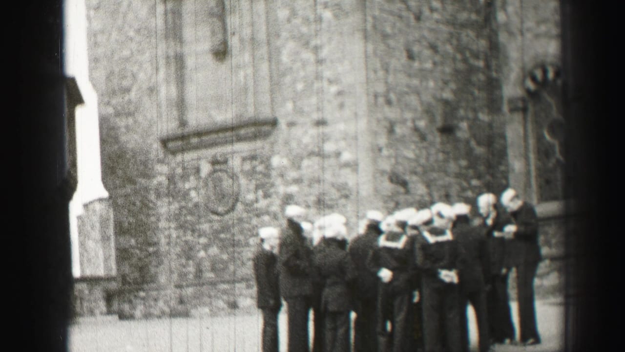 1952 Edinburgh footage shows sailors in white caps and suited men gathered near a historic stone church wall.