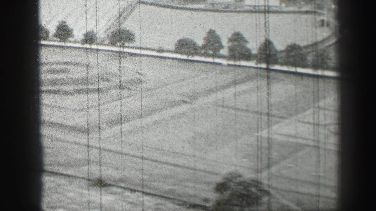 1952 Edinburgh frame looking over a landscaped grass area with path lines, perimeter trees, and visible 8mm wear.