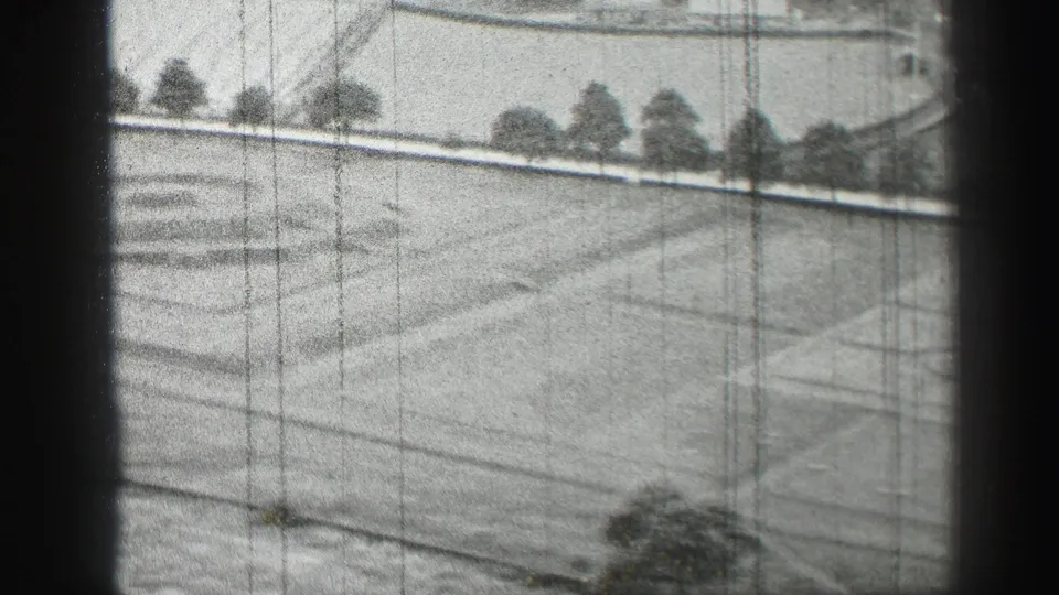 1952 Edinburgh frame looking over a landscaped grass area with path lines, perimeter trees, and visible 8mm wear.