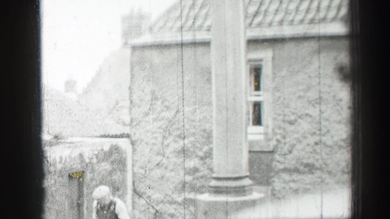 1952 Edinburgh exterior showing stone walls, a column, rooflines and a partly visible person near the building.