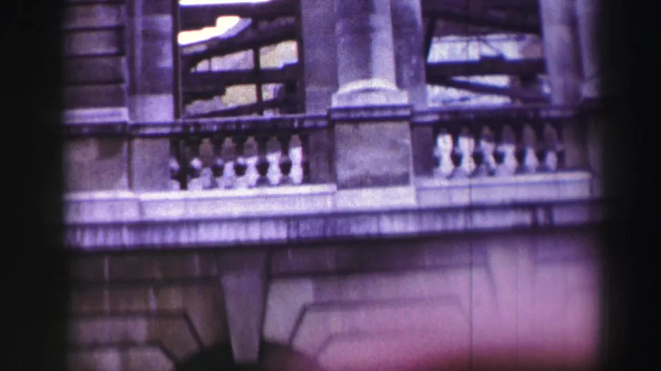 Edinburgh building exterior with balcony railings, columns and arched masonry details, tinted by aged 8mm color.