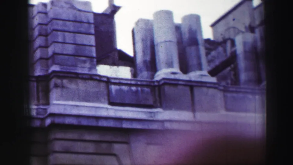 1952 8mm close view of a stone balcony section in Scotland, with rounded columns and heavy masonry details.