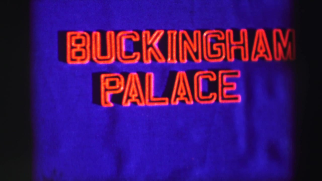Red Buckingham Palace sign on a blue background.
