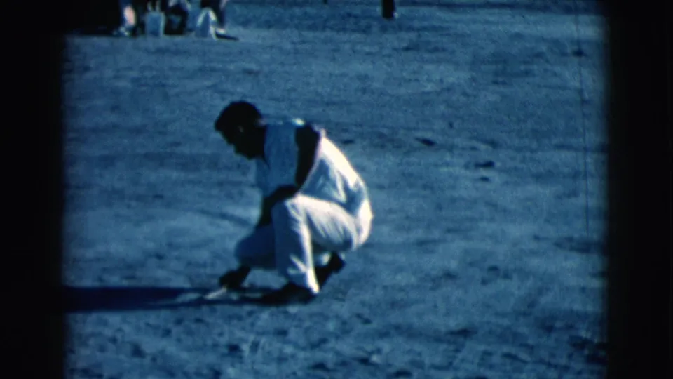 The final frame shows the Clarkdale man still crouched, his stick near the ground, with seated people faintly visible behind him.
