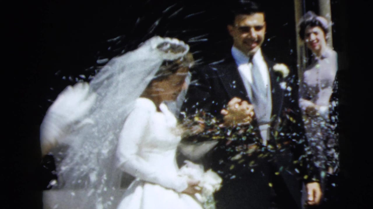 Bride and groom in Camden wedding footage as guests toss confetti during their church exit.