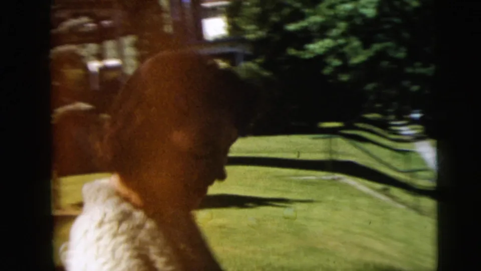 A profile view shows a person in a textured sweater near a green lawn and trees, with 8mm blur and frame-edge shadow.