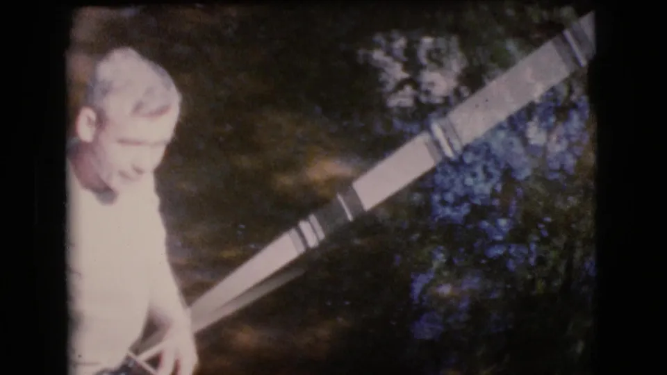 A softer 1964 Cottonwood, Arizona frame shows the man closer to camera with the fishing rod crossing the streamside scene.